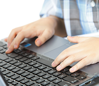 Student hands using a laptop